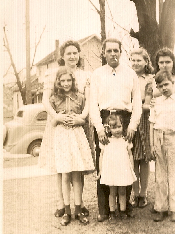 The Armstrong family standing together outside around 1940.